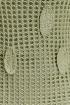 Close-up of a textured green crochet ...