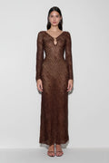 Woman wearing a brown lurex crochet maxi dress.